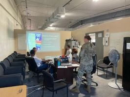 Airman First Class Jacquline Gibboney, Diet Therapy Technician from the 99th Medical Support Squadron, leads a nutrition education course for members of the 820th RED HORSE squadron at Nellis Air Force Base